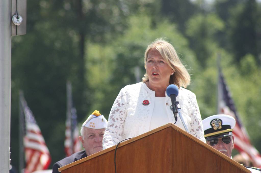 Monica McNeal, who lost her son in the war in Afghanistan, speaks to the crowd assembled for the ceremony at Tahoma National Cemetery on Monday. McNeal, the keynote speaker, is president of the Washington chapter of American Gold Star Mothers. MARK KLAAS, Kent Reporter