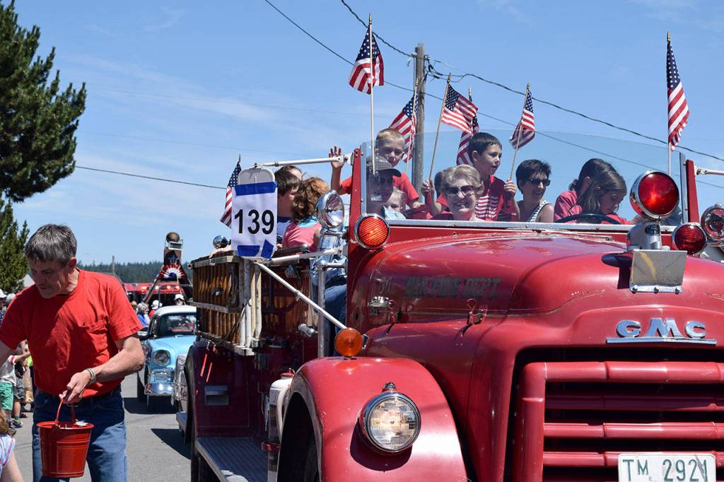More than 200 entrants comprise the Maxwelton Independence Day Parade thats viewed by an estimated 2,000 people, many coming from off island.