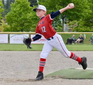 Vince Olsen delivers a pitch during the District 10 championship game. Olsen struck out seven. RACHEL CIAMPI, Auburn Reporter