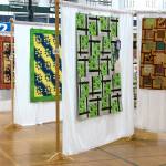 Photo by Kayse Angel                                Quilts that members of Covington Quilters Guild made hang on display.