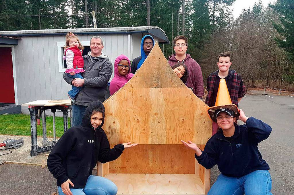 St. George Episcopals Youth Group in the process of building the pantry that provides free food and hygiene items for community members in need. Submitted photo