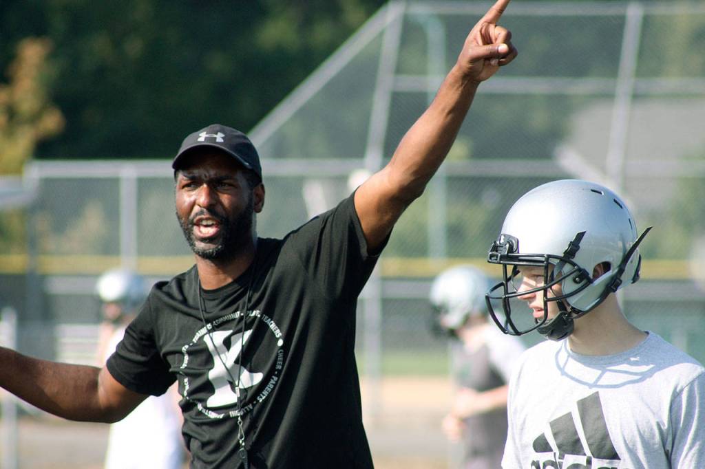 Kentwood coach Mike Bush directs traffic at practice. Bush and the Conquerors vow to go after another division crown and make a deeper run in the postseason. MARK KLAAS, Kent Reporter