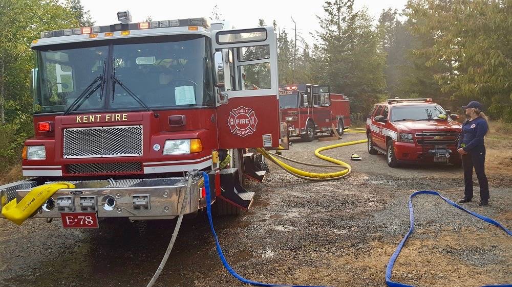 Area firefighters were on the scene, beating back a growing brush near Highway 18 on Sunday. COURTESY PHOTO, Puget Sound RFA