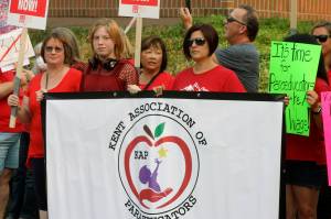 Kent Association of Paraeducators members rally outside the Kent School District Office on Aug. 22. MARK KLAAS, Kent Reporter