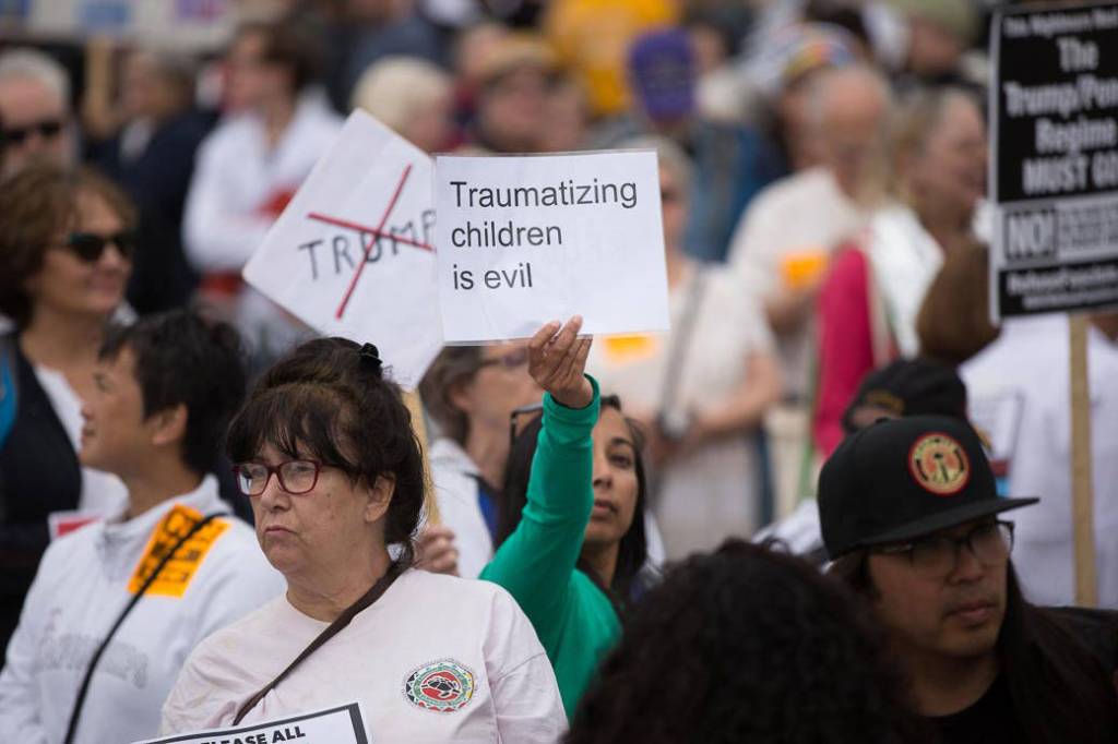 Protesters gather at SeaTacs Families Belong Together rally. Photo by Alex Garland