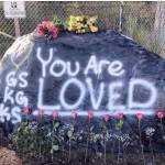 Submitted photo by Haley Armstrong                                A rock outside of Tahoma High School was painted and decorated with flowers to honor the death of three Tahoma students  Garrett Sypole, Kione Gill and Kylee Snyder.