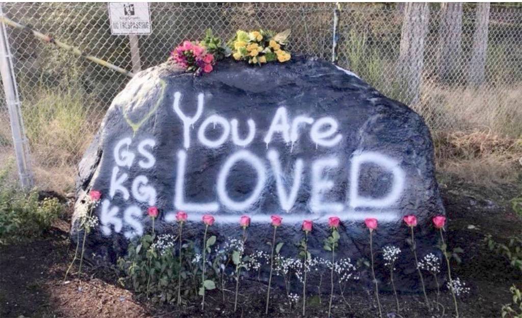Submitted photo by Haley Armstrong                                A rock outside of Tahoma High School was painted and decorated with flowers to honor the death of three Tahoma students  Garrett Sypole, Kione Gill and Kylee Snyder.