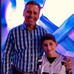 Seattle Seahawks legend Steve Largent shares a moment with a lifelong fan, Logan Kelley, 11, Silverdale. Photo by Eric LaFontaine