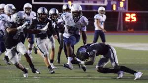 Auburn Riverside Jayden Solis bursts up the middle to score on a 29-yard run in the first quarter against Kentwood on Thursday night. RACHEL CIAMPI, Kent Reporter