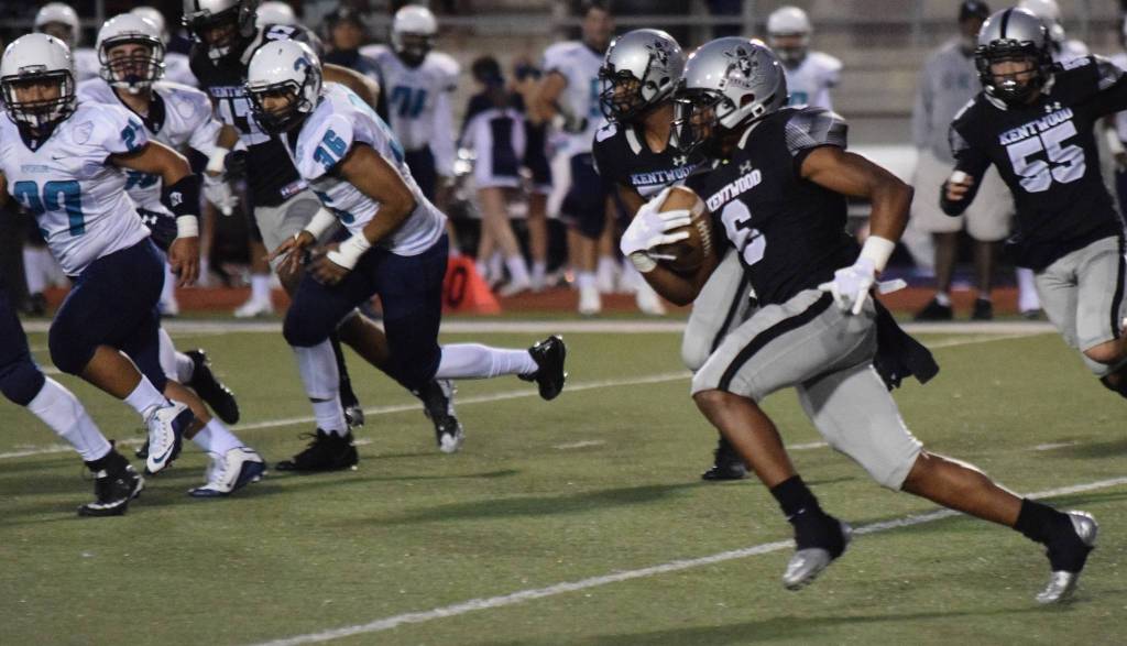 Kentwoods Dyllon Daniels returns a kickoff 90 yards for a touchdown against Auburn Riverside on Thursday night. RACHEL CIAMPI, Kent Reporter