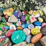 Submitted photo by Nicole Casey                                Rocks that students and community members painted to show love and support were set around the spirit rock at Tahoma High School.