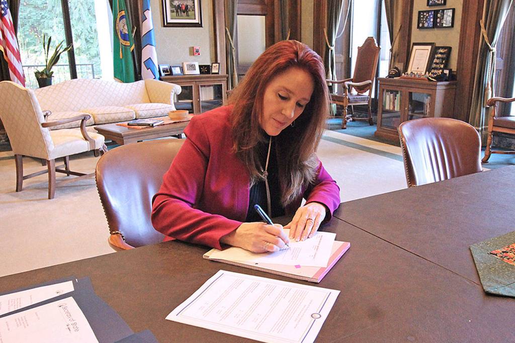 Washington Secretary of State Kim Wyman certifies the results of the 2018 General Election in Olympia on Tuesday, Dec. 4. Courtesy Office of the Secretary of State