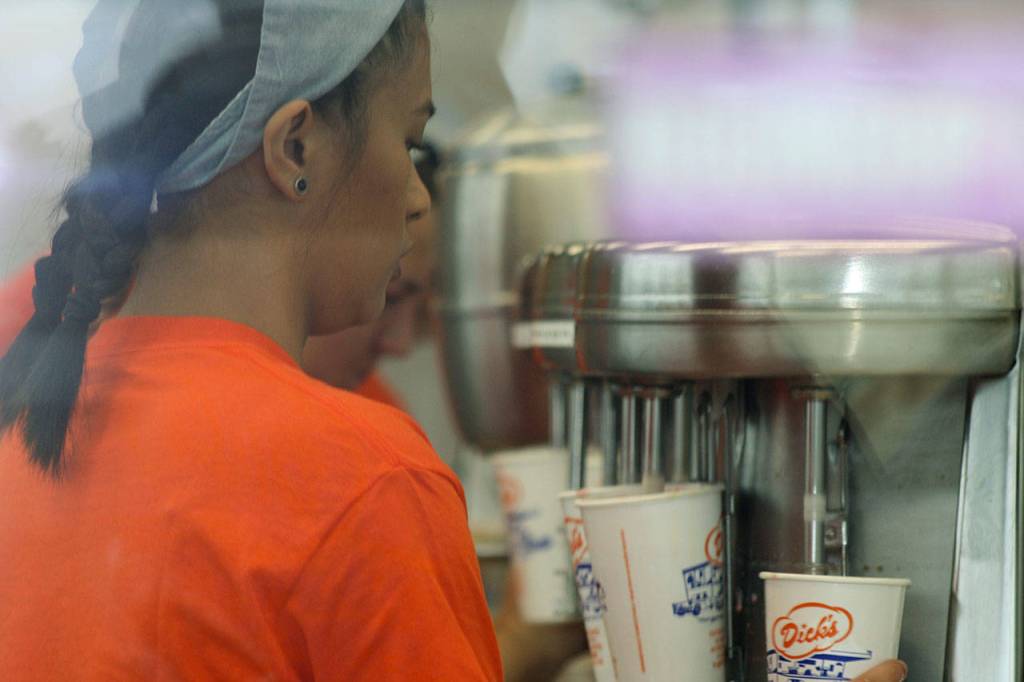 An employee prepares shakes at the new Kent location of DIcks Drive-In. STEVE HUNTER, Kent Reporter