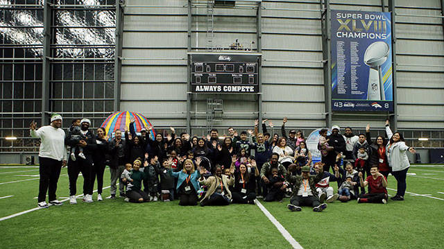 The group of families and Seahawks pose for a group photo during Mondays event. Courtesy photo Seattle Seahawks