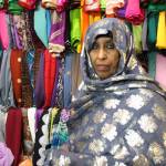 Nadifa Yusef, a Somalian immigrant and SeaTac shop owner, showcases some of her garments. They are traditional Somali dresses called dirac. Aaron Kunkler/staff photo