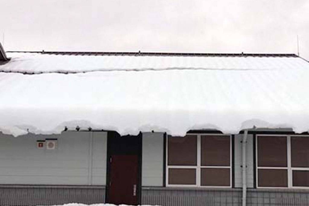 Snow sliding off the roof of Summit Trail Middle School. Photo pulled from Tahoma School District website
