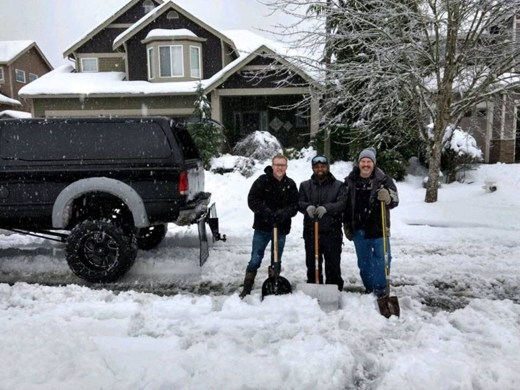 During the recent snow, these three neighbors roamed Valley Meadows looking for people who were stuck in the snow. When William Petersons car was snuck in the snow, he said they jumped right out of their truck and started shoveling his car out. Submitted photo from William Peterson