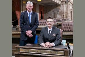Rep. Pat Sullivan with Page Caleb Grant. Photo credit Washington State Legislative Support Services