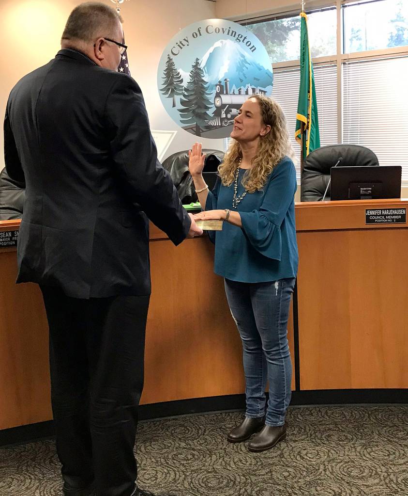 Covington Mayor Jeff Wagner swears Jennifer Harjehausen in on April 11. Harjehausen will be serving on Position No. 2. Photo by Kayse Angel