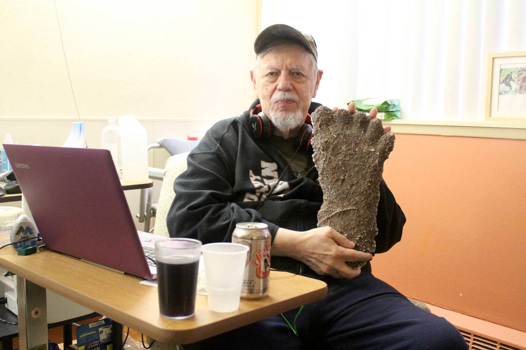 Thom Cantrell, one of the organizers of the upcoming International Conference for Primal People, holds up a mould of a Sasquatch footprint. He said the mould was taken in the Blue Mountains in Oregon by Paul Freeman, a well-known Sasquatch hunter whos 1994 footage of a Sasquatch in that area made big waves in the believer and skeptic communities alike. Photo by Ray Miller-Still