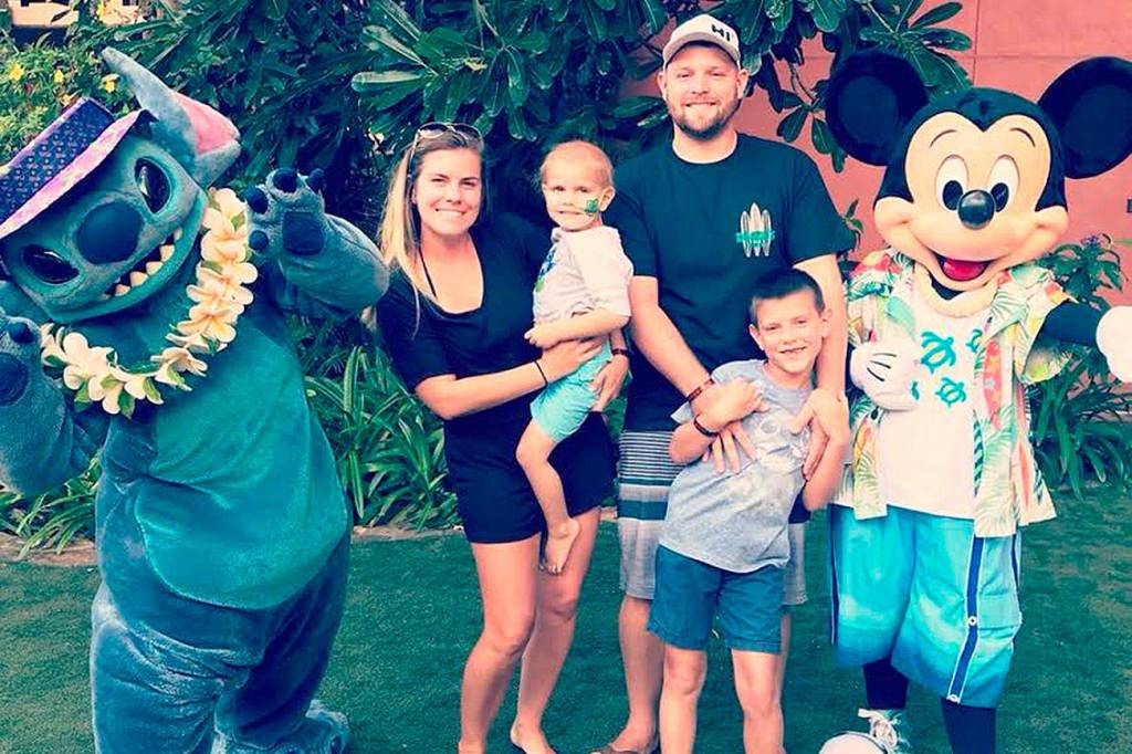 Hunter Coffman and his family pose with Stitch in Hawaii. One of Hunters dreams was to meet Stitch and it was mad possible because of community support. Submitted photo from Laura Coffman