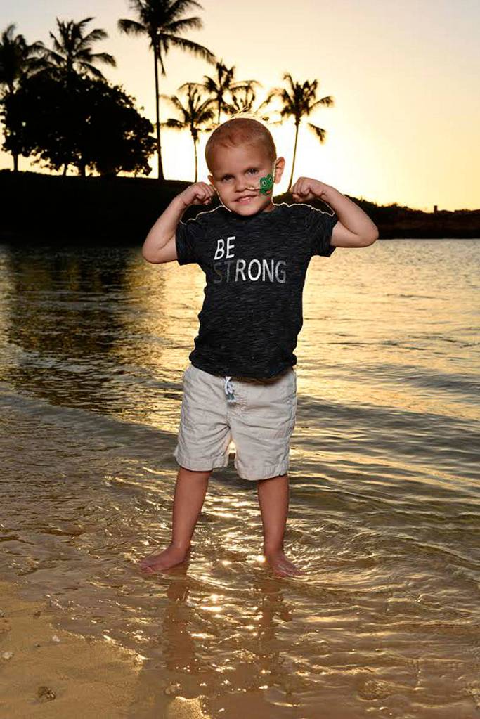 Hunter Coffman showing off how strong he is by the ocean. Submitted photo from Laura Coffman