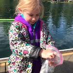 Emily Morgan holds her newly caught fish during the Lake Wilderness Hooked On Fishing Derby. Photo by Kayse Angel