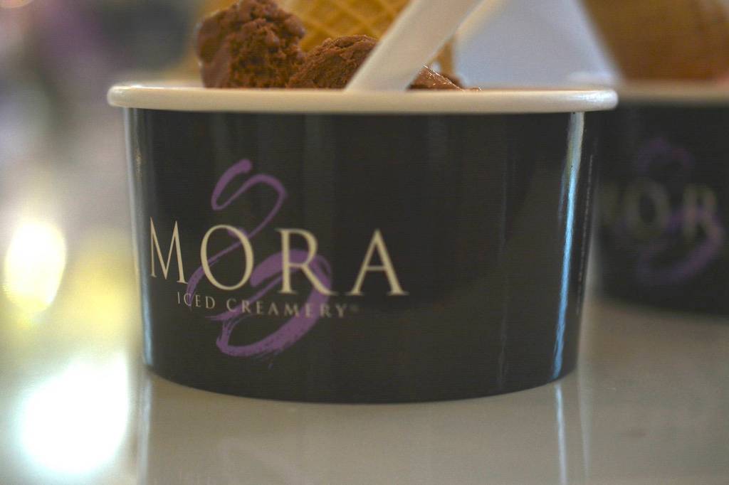 A customer checks out their grand scope of Mora ice cream during the Mora Iced Creamery grand opening on April 24 in Covington. Photo by Kayse Angel