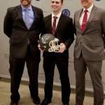 Hudson Potts receives his award with his coaches, Brett Thompson, left, and Kevin Hurt. COURTESY PHOTO