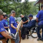 Photo courtesy of Building Beyond the Walls                                 Building Beyond the Walls volunteers building Terry Hildebrands ramp alongside his family.