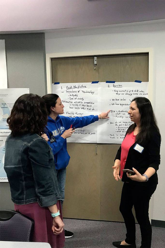 Photo by Kayse Angel                                 Community members talking about why technology is important is in the Tahoma School District during an Engage Tahoma meeting.