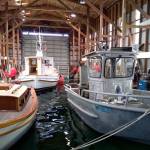 Dunatos Boat Yard is building a smaller vessel, seen on the right, which will be used for reclamation efforts on Lake Sammamish and smaller waterways in the area. Aaron Kunkler/staff photo