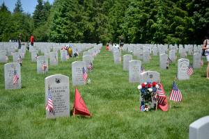 Photos by Kayse Angel                                 Grave stones with flags and flowers at the Tahoma National Cemetery on May 27.