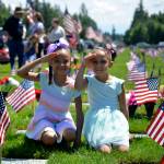 Photos by Kayse Angel                                 Jaya and Keira Stroud salute on Memorial Day at the Tahoma National Cemetery on May 27.