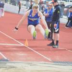 Tahoma track student Katie Welsh leaps into the sand during the long jump. File photo by Kayse Angel