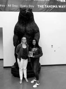 Photo by Kayse Angel                                 Kaiea Higa (right), a freshman fast pitch player for the Tahoma High School Bears, won the first ever Female Athlete of the Year award from the Covington-Maple Valley Reporter. She received a special plaque from the Reporters editor Danielle Chastaine (left).