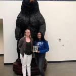 Photo by Kayse Angel                                 Kaiea Higa (right), a freshman fast pitch player for the Tahoma High School Bears, won the first ever Female Athlete of the Year award from the Covington-Maple Valley Reporter. She received a special plaque from the Reporters editor Danielle Chastaine (left).