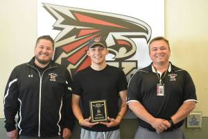 Alex Lopez (middle), is a wrestler and a senior at Kentlake High School. He was the winner of the Reporters Athlete of the Year. Coach Jeremy Williams (right) and coach Michael Andrews (left) said Lopezs attitude and committment earned him the award.