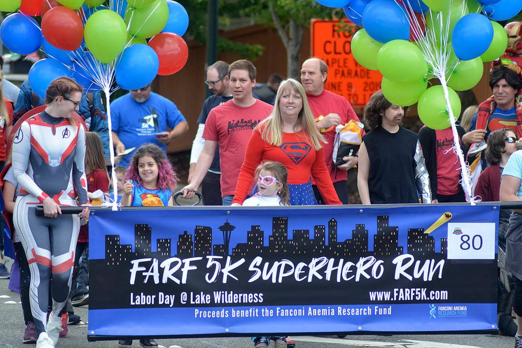 Superheroes marched along Witte Road during the Maple Valley Days Parade on June 8 to promote the Superhero 5K Run during Labor day. Photo by Kayse Angel