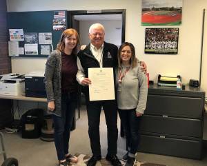 Submitted photo from King County Council.                                 Dave Lutes holds the proclamation from the King County Council declaring June 7 as Dave Lutes Day with Amy Erickson and Holly Potts with the Kent School District.