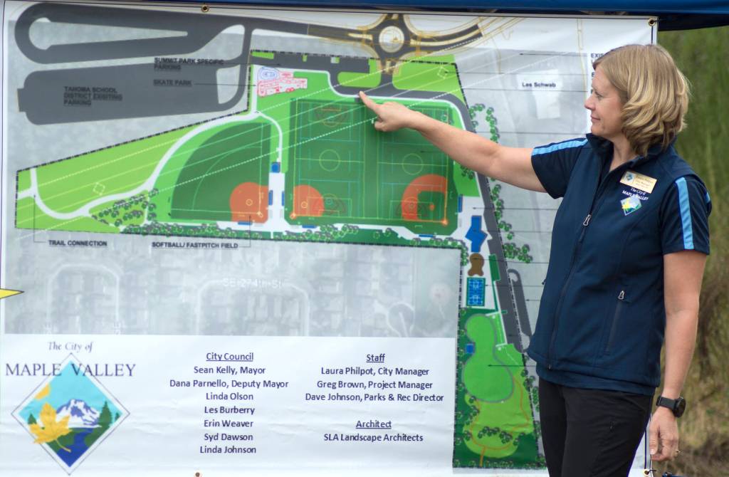 A Maple Valley Parks Department employee shows where on the map certain elements will be placed in Summit Park. Photo courtesy of the City of Maple Valley.