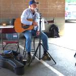 Jim Hanna preforms songs at the Maple Valley Farmers Market during its opening day on June 15.