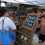 Community members takes samples at one of the stands at the Maple Valley Farmers Market.