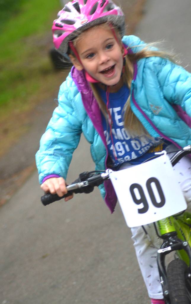 Lydia Malmberg races to the end of the racing track during the Maple Valley Bike Safety Rodeo and Bike Challenge that took place on June 22 at Lake Wilderness Park.