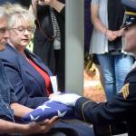 A military leader presents the American flag to former Tahoma High teacher Bill Pringles family member, the only one who attended his memorial service on June 25. Photo by Kayse Angel