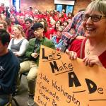 Mukilteo School District teachers urge elected officials to renegotiate their salaries at a school board meeting back in June 2018. On Monday, they got a deal they like. (Andrea Brown / Herald file)