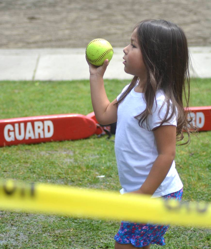 Photos by Kayse Angel                                 Serinitee Paypay throws a ball at the dunk tank during the Maple Valley Kids Fest on July 13 at Lake Wilderness Park.