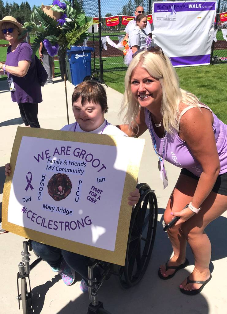 Tina McDonough poses for a picture with Cecile Snyder, a Tahoma Sparkle cheerleader who was diagnosed with lymphoblastic leukemia (ALL). Photo by Kayse Angel