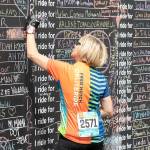 A Obliteride event participant writes the name of someone they love who was affected by cancer, which is why those choose to raise funds for Fred Hutchs cancer research. Photo courtesy of Fred Hutch Obliteride.                                 A Obliteride event participant writes the name of someone they love who was affected by cancer, which is why those choose to raise funds for Fred Hutchs cancer research. Photo courtesy of Fred Hutch Obliteride.