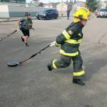 Photos by Danielle Chastaine.                                  Students in the Barbells and Badges summer camp at Cedar Heights Middle School compete on team firefighter or team police on Friday, Aug. 9. Photo courtesy of the Covington Police Department.